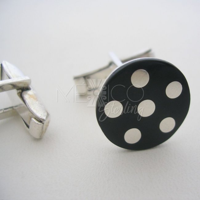 Sterling Silver Cufflinks and Black Background